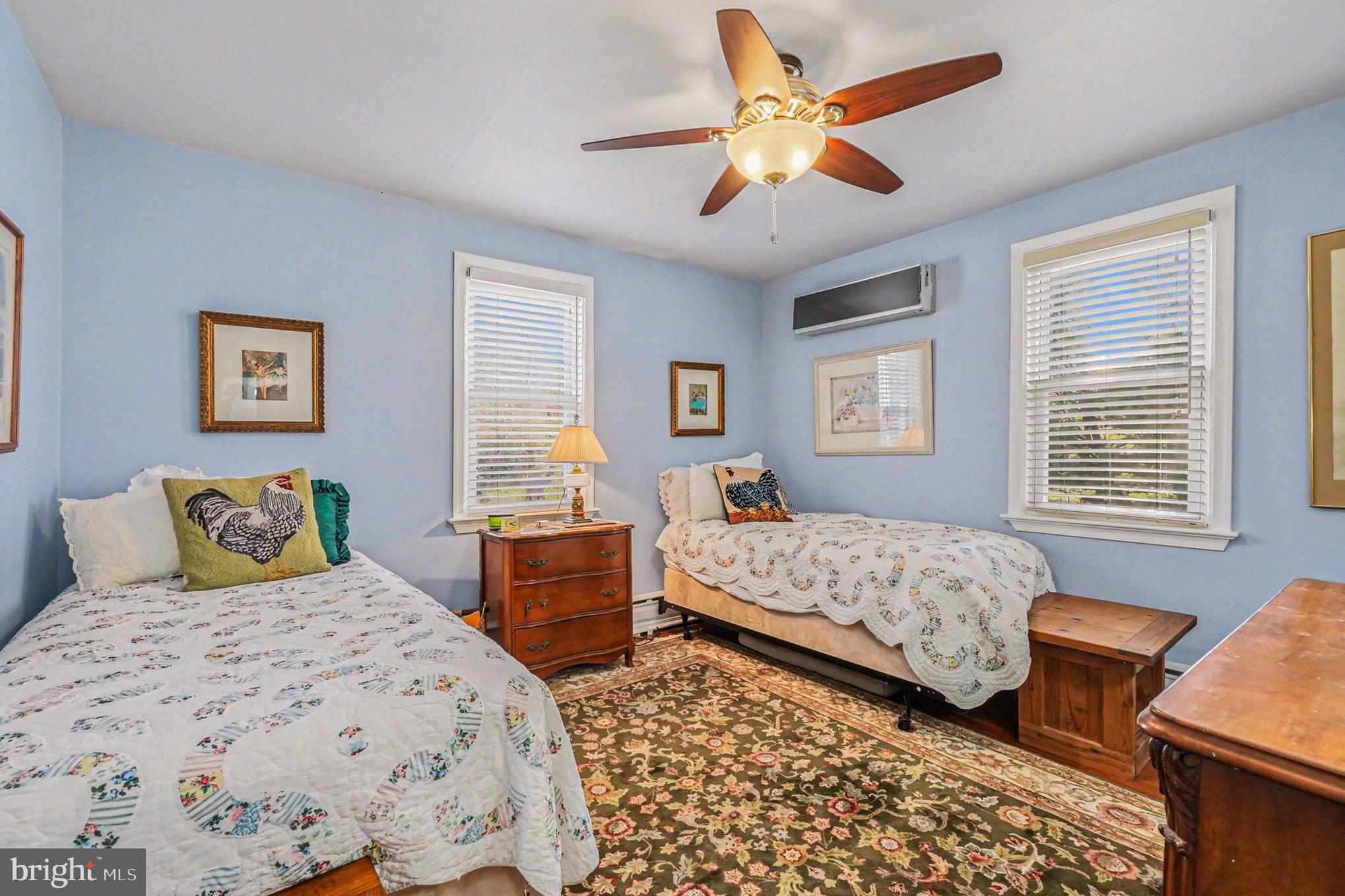 112 Midway Drive Earleville, MD 21919 - Photo 28 of 47 a bedroom with two beds and a window