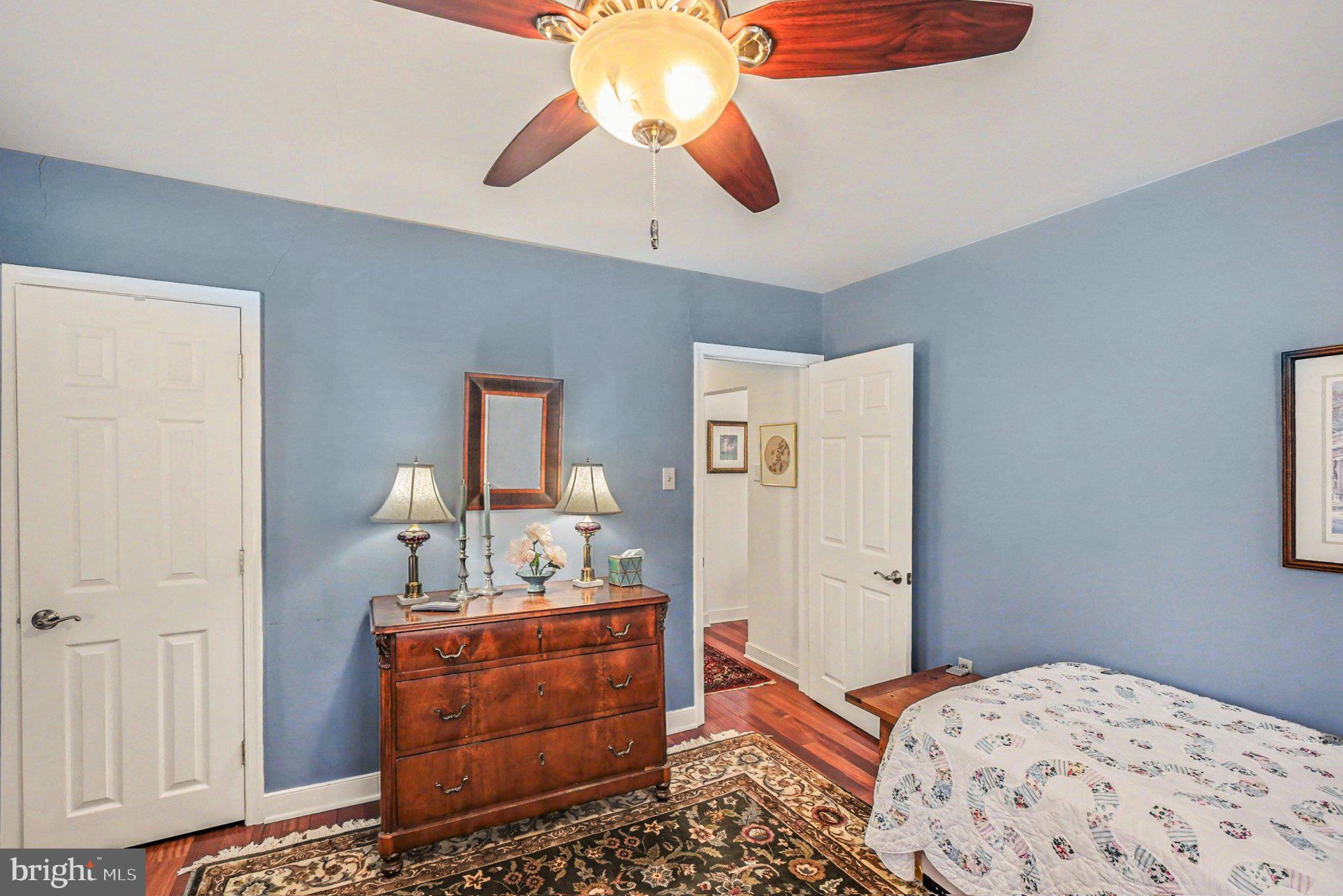 112 Midway Drive Earleville, MD 21919 - Photo 29 of 47 a bedroom with a bed and wooden floor