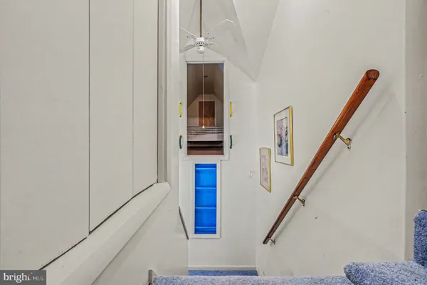 a bedroom with two beds and a chandelier