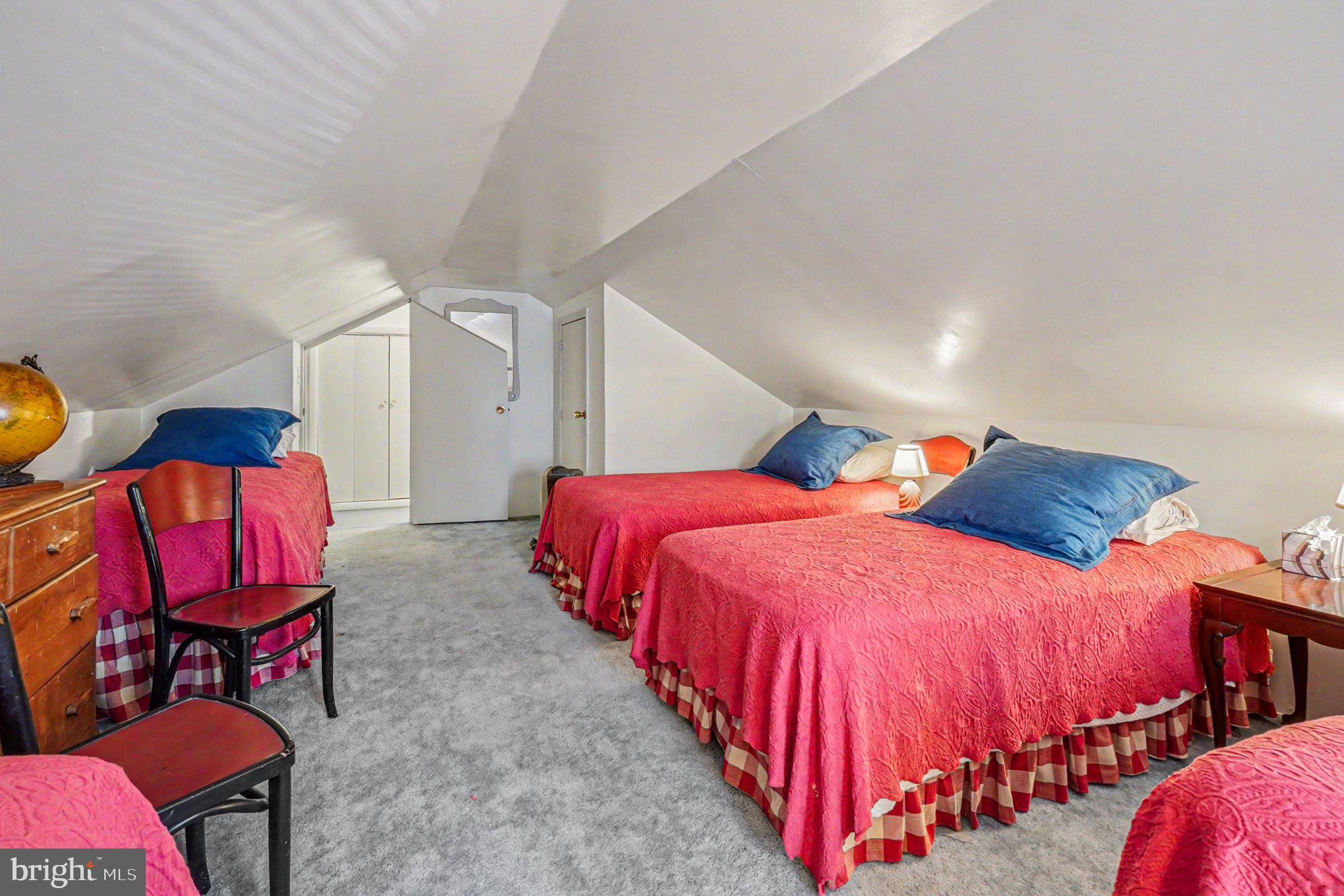 112 Midway Drive Earleville, MD 21919 - Photo 32 of 47 a bedroom with three beds and chair