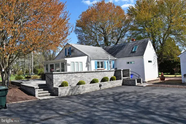 a view of house with outdoor seating and city view