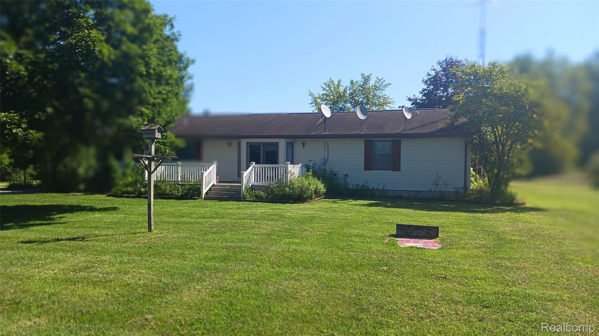 3803 Warner Road Cass City, MI 48726 - Photo 2 of 85 Back of property with a lawn and a deck