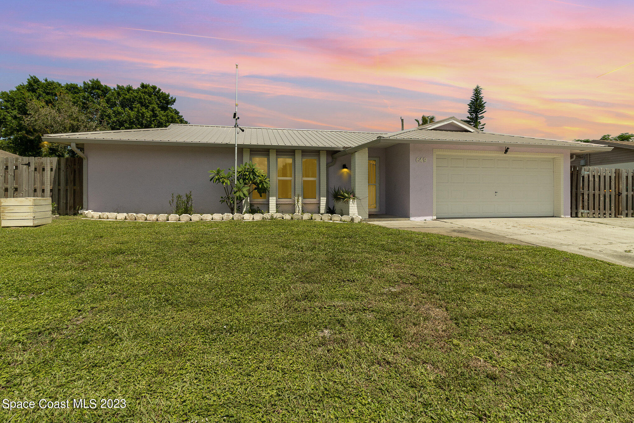 649 Croton Road Melbourne, FL 32935 - Photo 1 of 22 a front view of a house with a yard