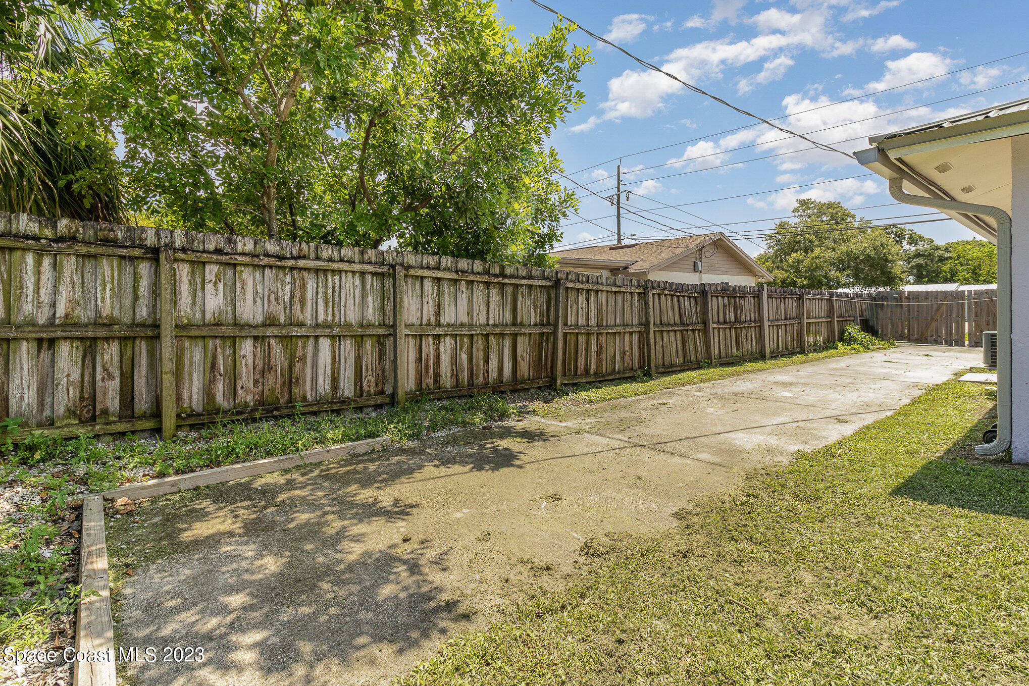 649 Croton Road Melbourne, FL 32935 - Photo 20 of 22 a view of backyard with wooden fence