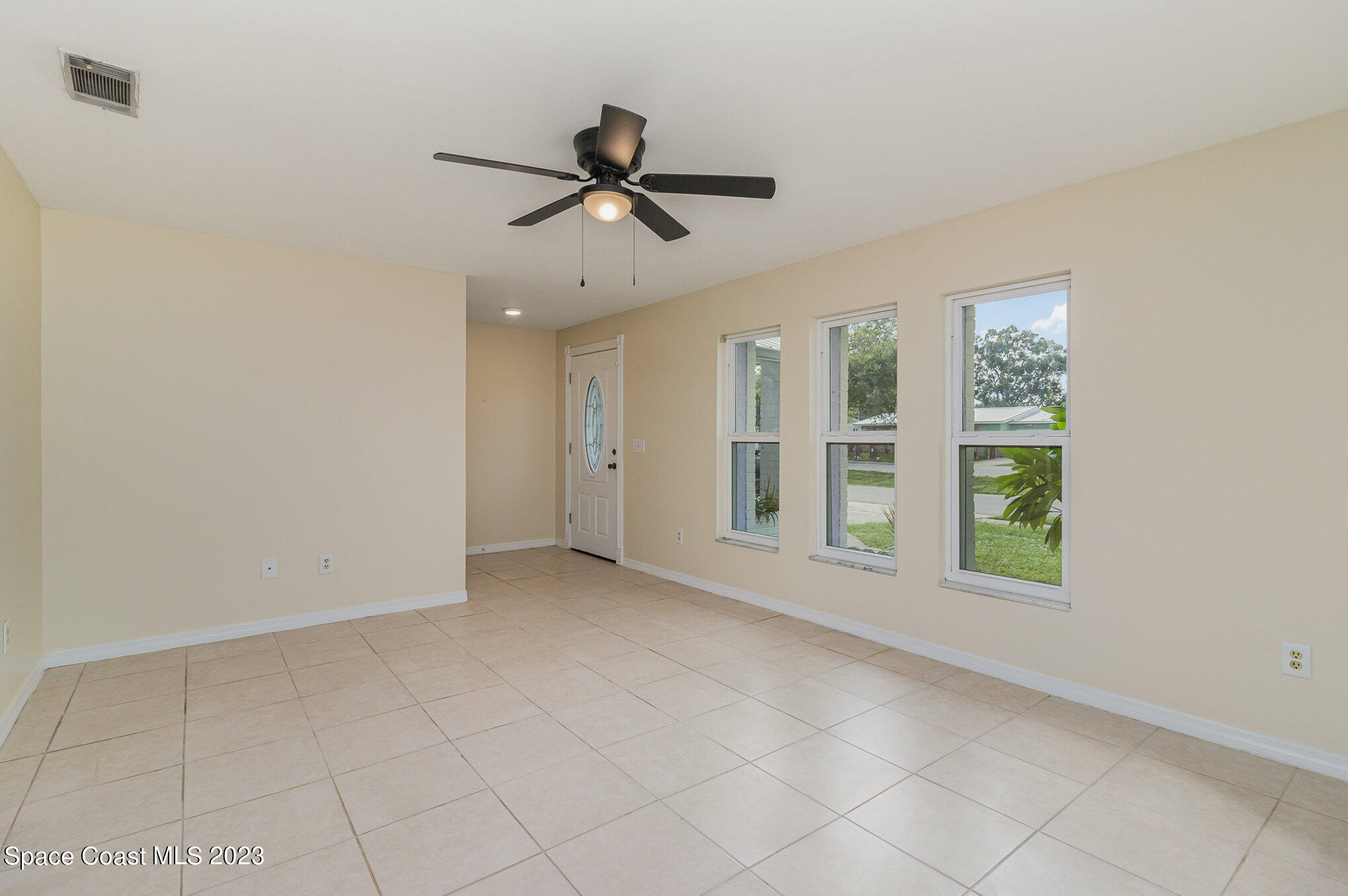 649 Croton Road Melbourne, FL 32935 - Photo 4 of 22 a view of an empty room with a window