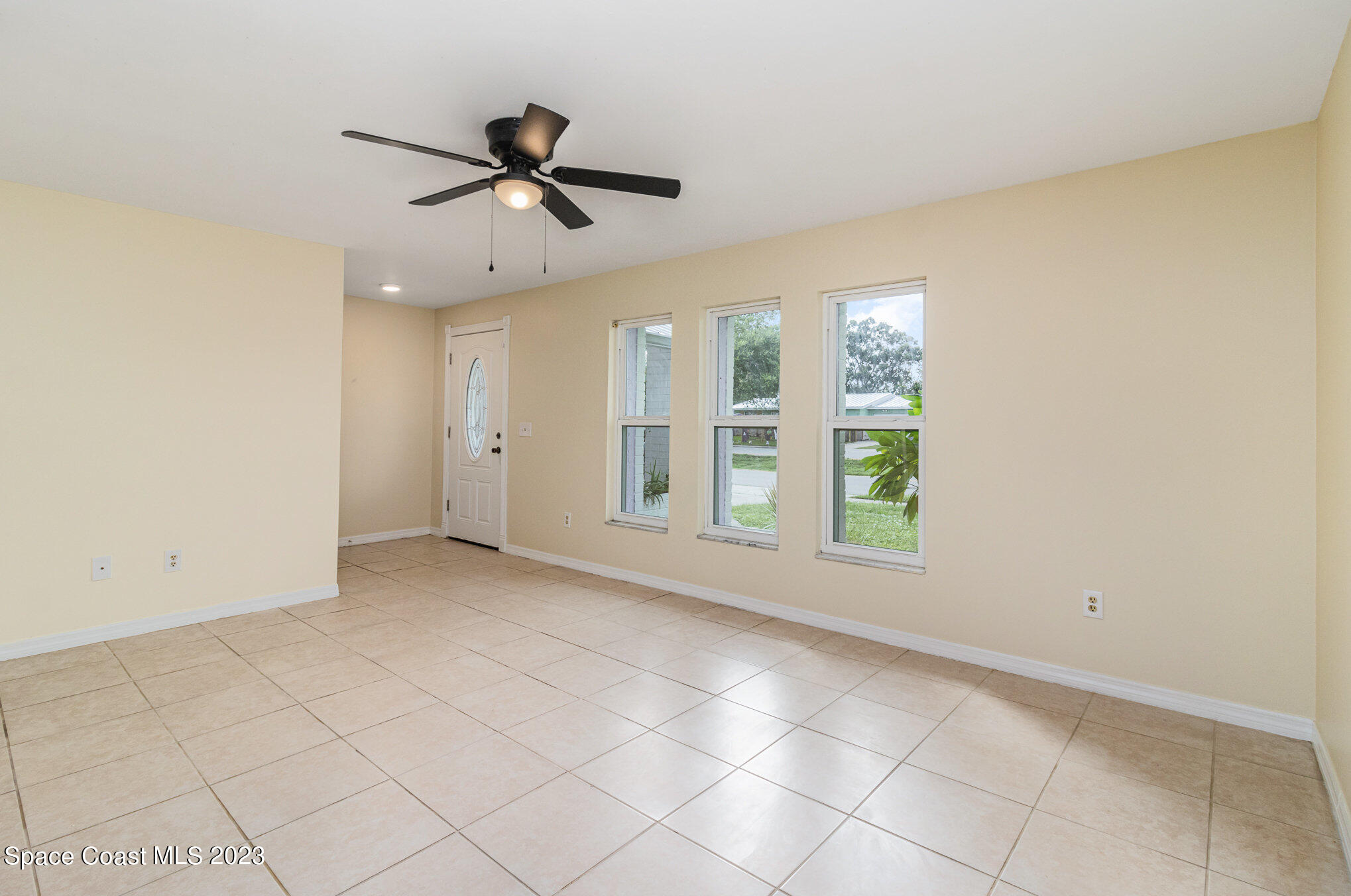 649 Croton Road Melbourne, FL 32935 - Photo 5 of 22 a view of an empty room with a window