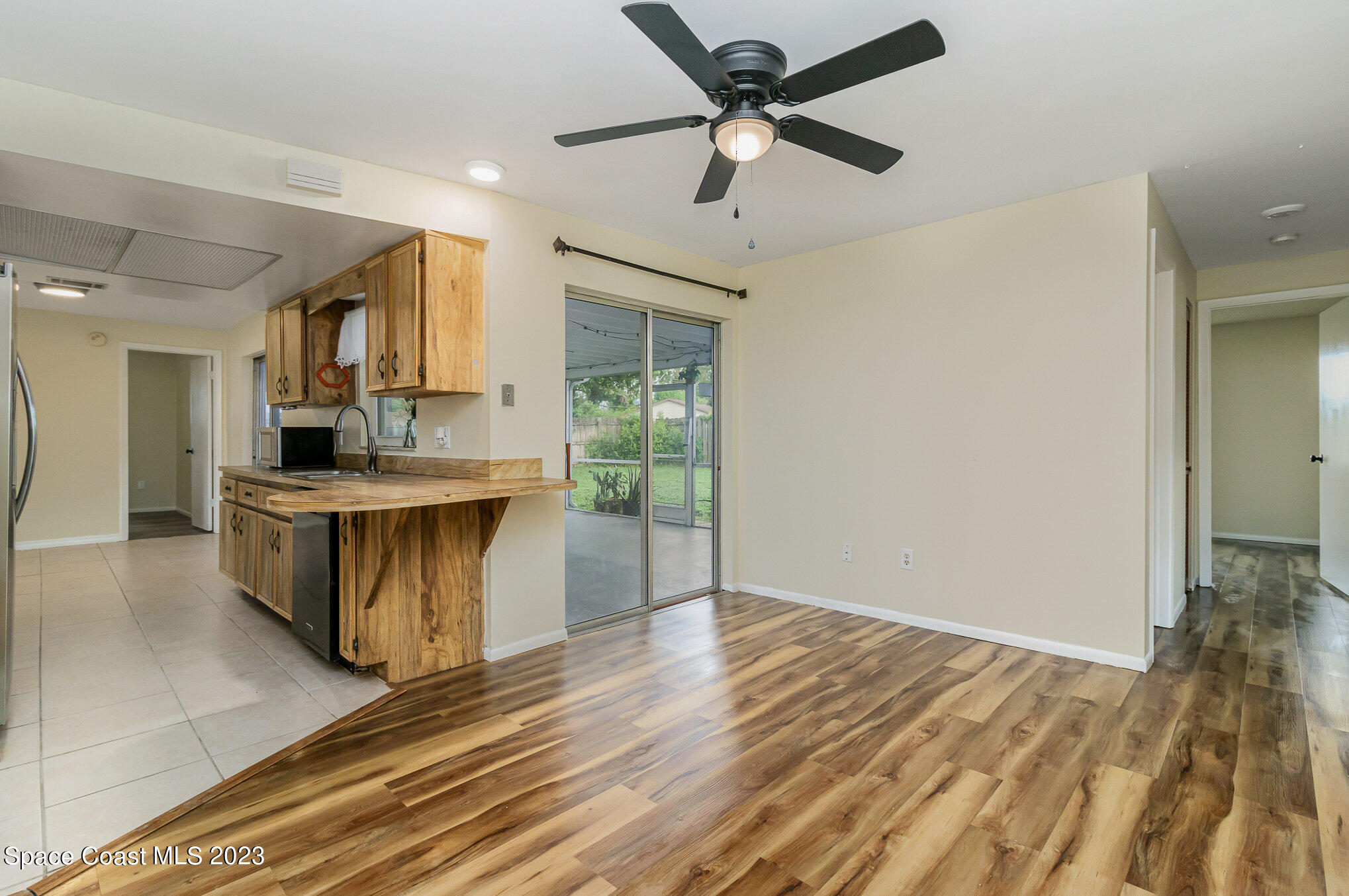 649 Croton Road Melbourne, FL 32935 - Photo 10 of 22 a kitchen with stainless steel appliances granite countertop a stove and a sink
