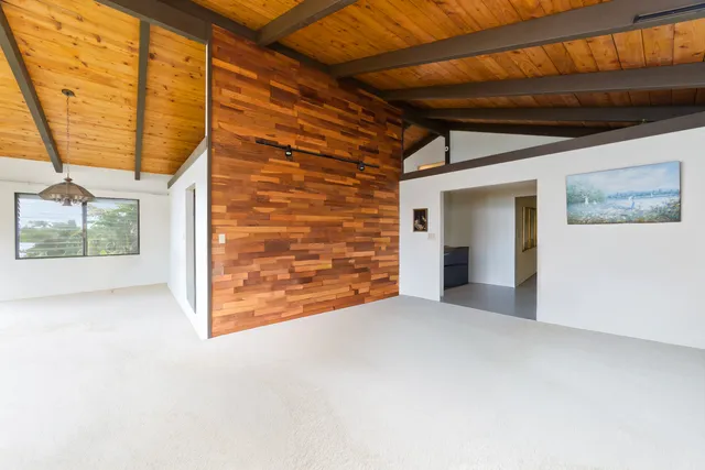 a view of an empty room with a sliding door