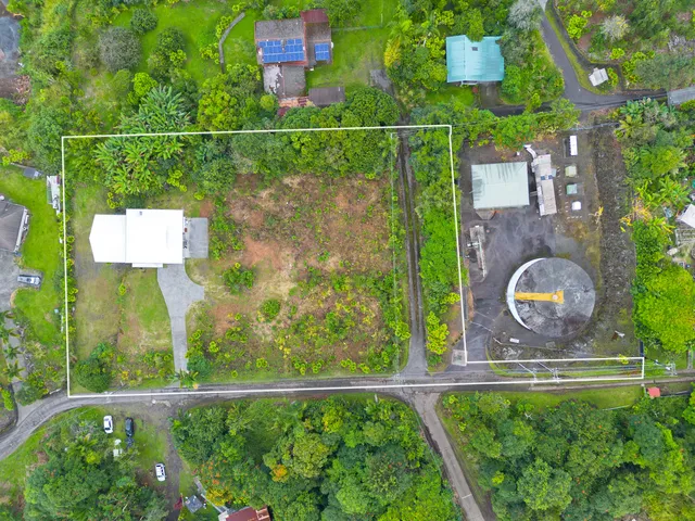 an aerial view of a house with outdoor space pool seating area and yard