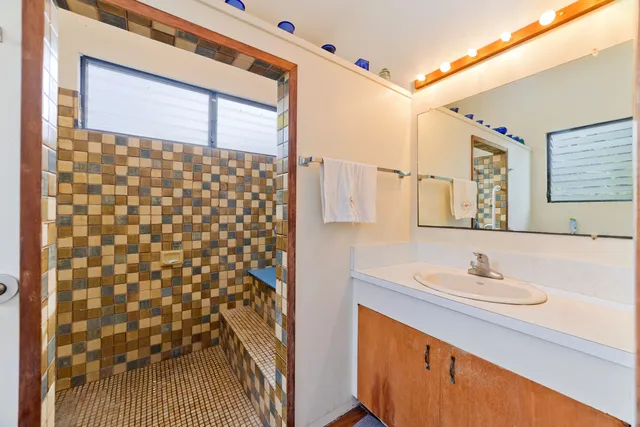 a bathroom with a toilet and a shower curtain