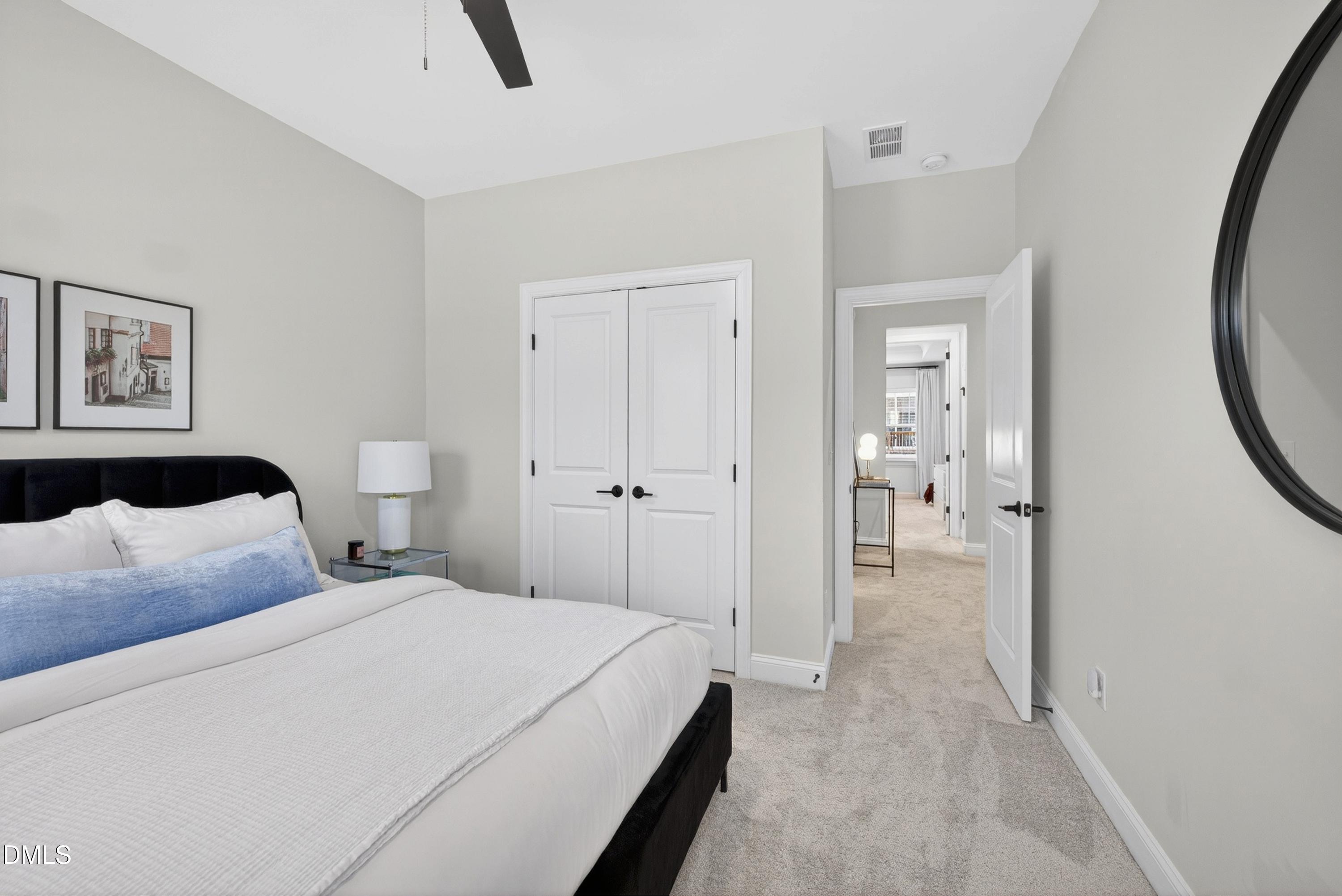 1063 Danvers Loop Apex, NC 27523 - Photo 51 of 67 a bedroom with a bed and a view of bathroom