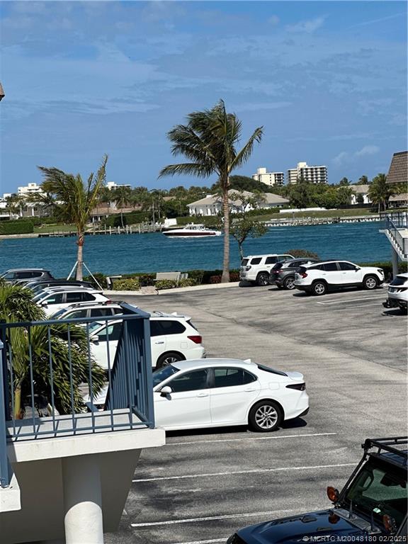 755 Saturn Street, Unit F205 Jupiter, FL 33477 - Photo 19 of 19 a view of a street with cars