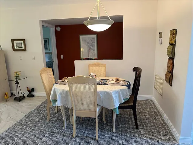 a view of a dining room with furniture
