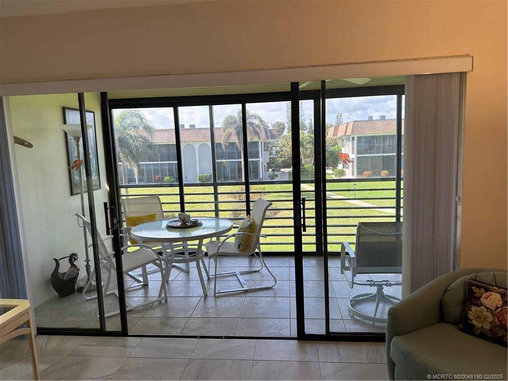 755 Saturn Street, Unit F205 Jupiter, FL 33477 - Photo 7 of 19 a view of a livingroom with furniture