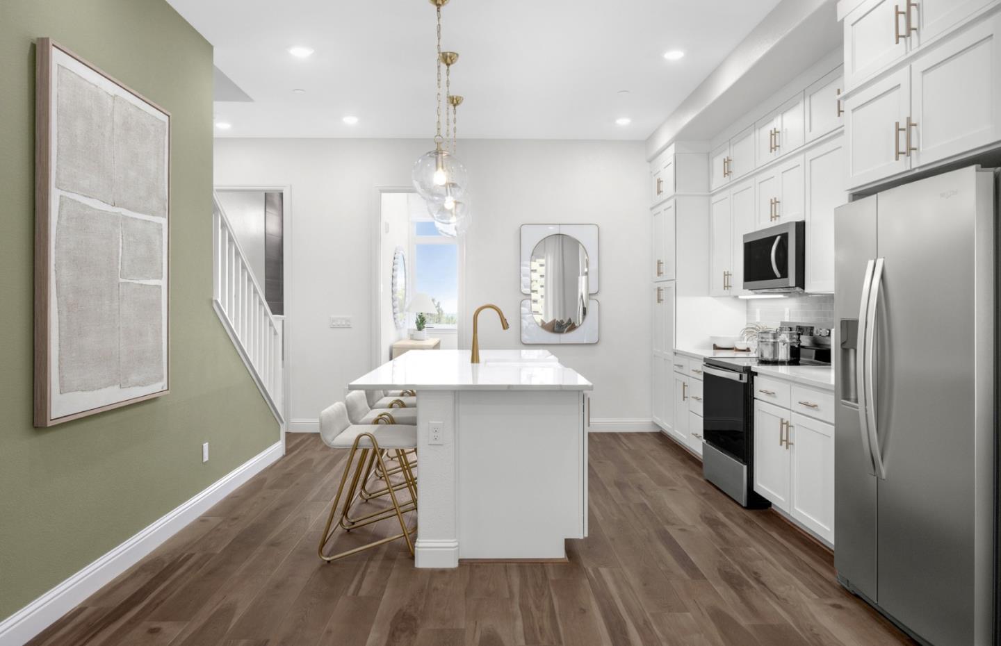 2419 Willow Way San Mateo, CA 94403 - Photo 12 of 17 a kitchen with kitchen island white cabinets and stainless steel appliances