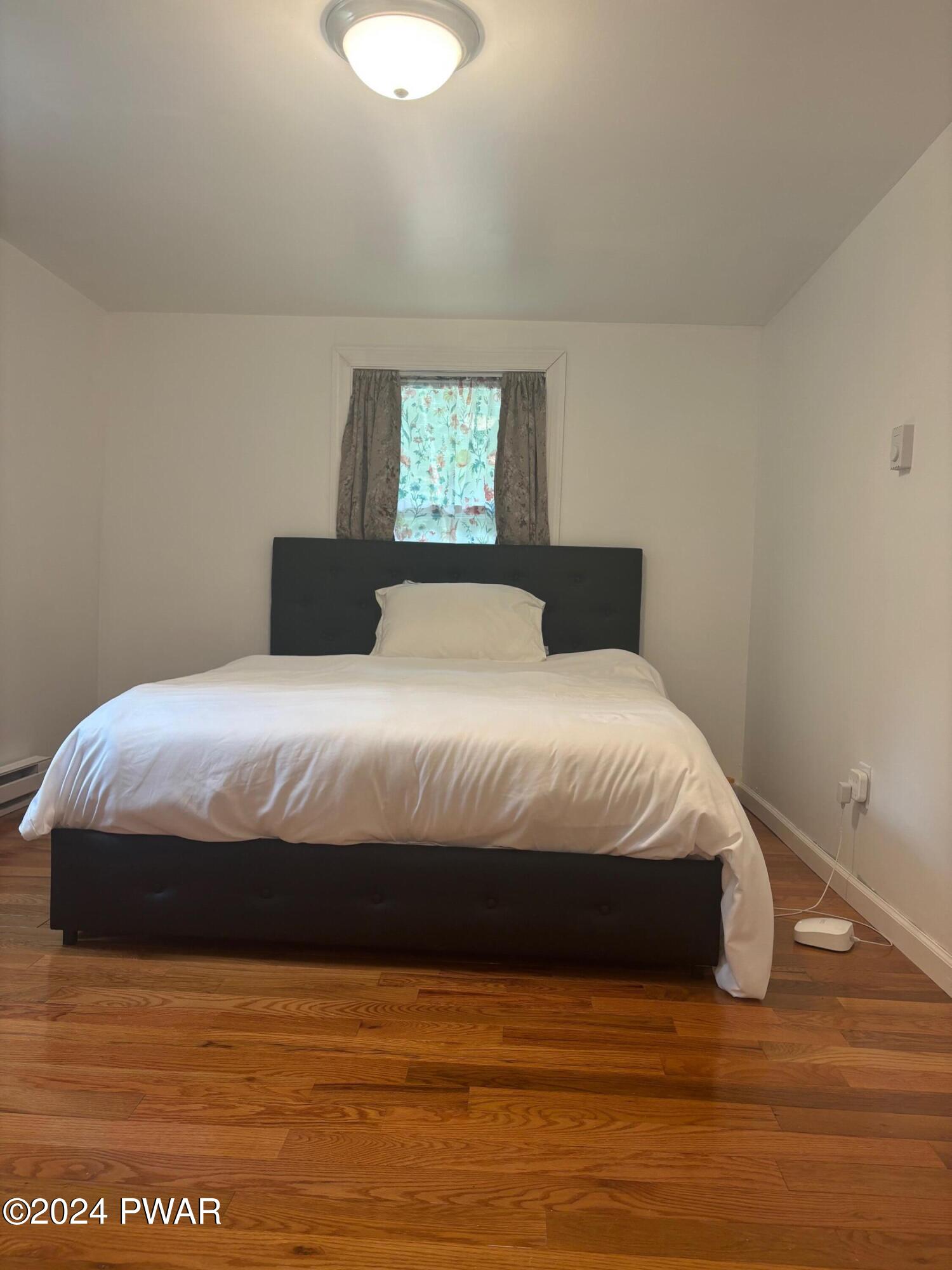 1113 Bracts Road Effort, PA 18330 - Photo 13 of 27 a bedroom with a bed and a window