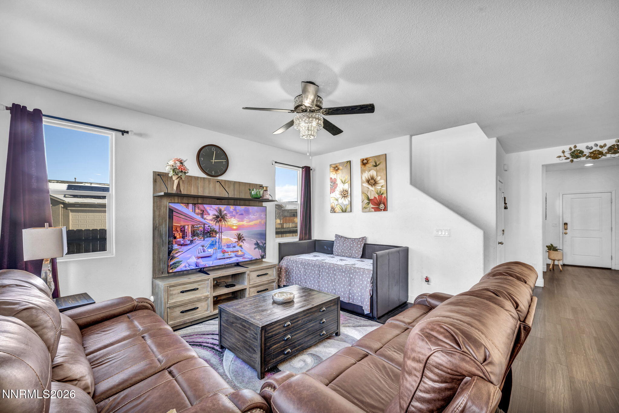 969 Estuary Circle Reno, NV 89506 - Photo 6 of 38 a living room with furniture ceiling fan and a rug