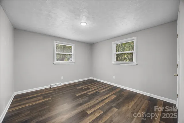 a view of room with window and ceiling fan