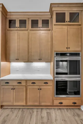a kitchen with stainless steel appliances and cabinets