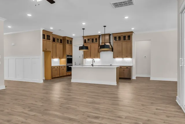 a view of kitchen with wooden floor