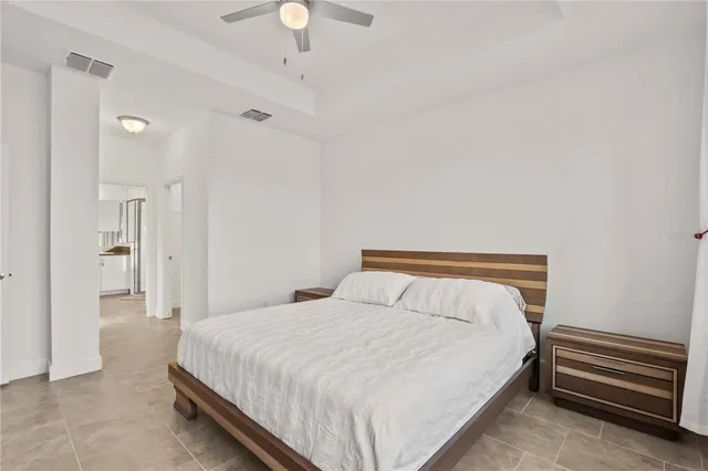 a view of a hallway with a cabinet and mirror