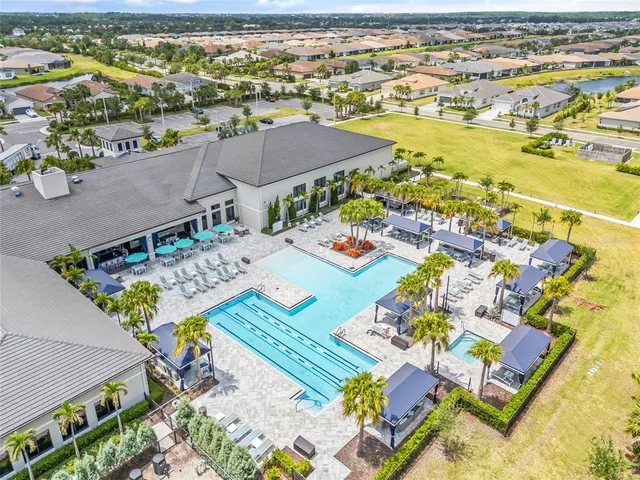 a outdoor dining space with furniture and a large window