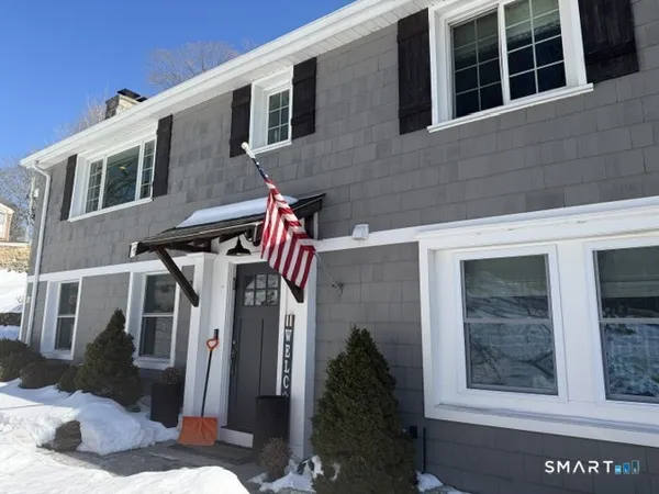a front view of a house with a yard