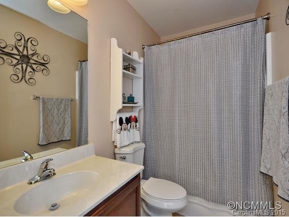 91 West Swift Creek Road Fletcher, NC 28732 - Photo 12 of 14 a bathroom with a sink toilet and shower