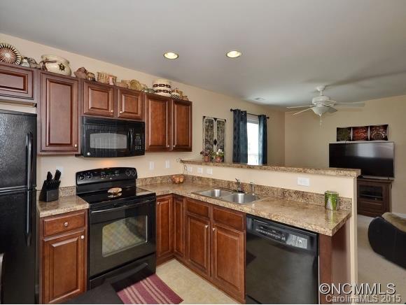 91 West Swift Creek Road Fletcher, NC 28732 - Photo 3 of 14 a kitchen with granite countertop a sink and steel appliances