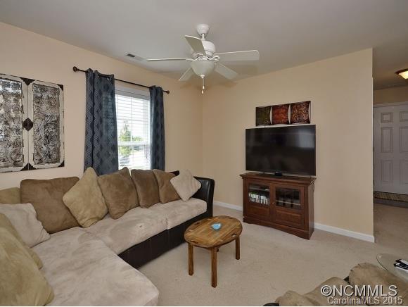 91 West Swift Creek Road Fletcher, NC 28732 - Photo 5 of 14 a living room with furniture and a flat screen tv