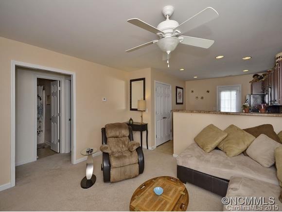 91 West Swift Creek Road Fletcher, NC 28732 - Photo 7 of 14 a living room with furniture and a chandelier