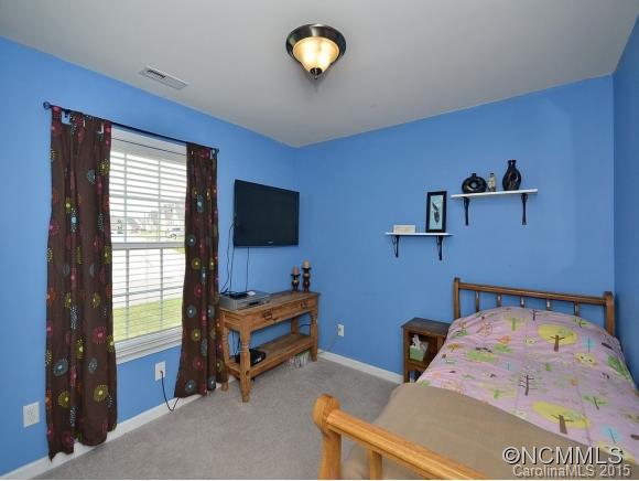 91 West Swift Creek Road Fletcher, NC 28732 - Photo 10 of 14 a bedroom with bed and window