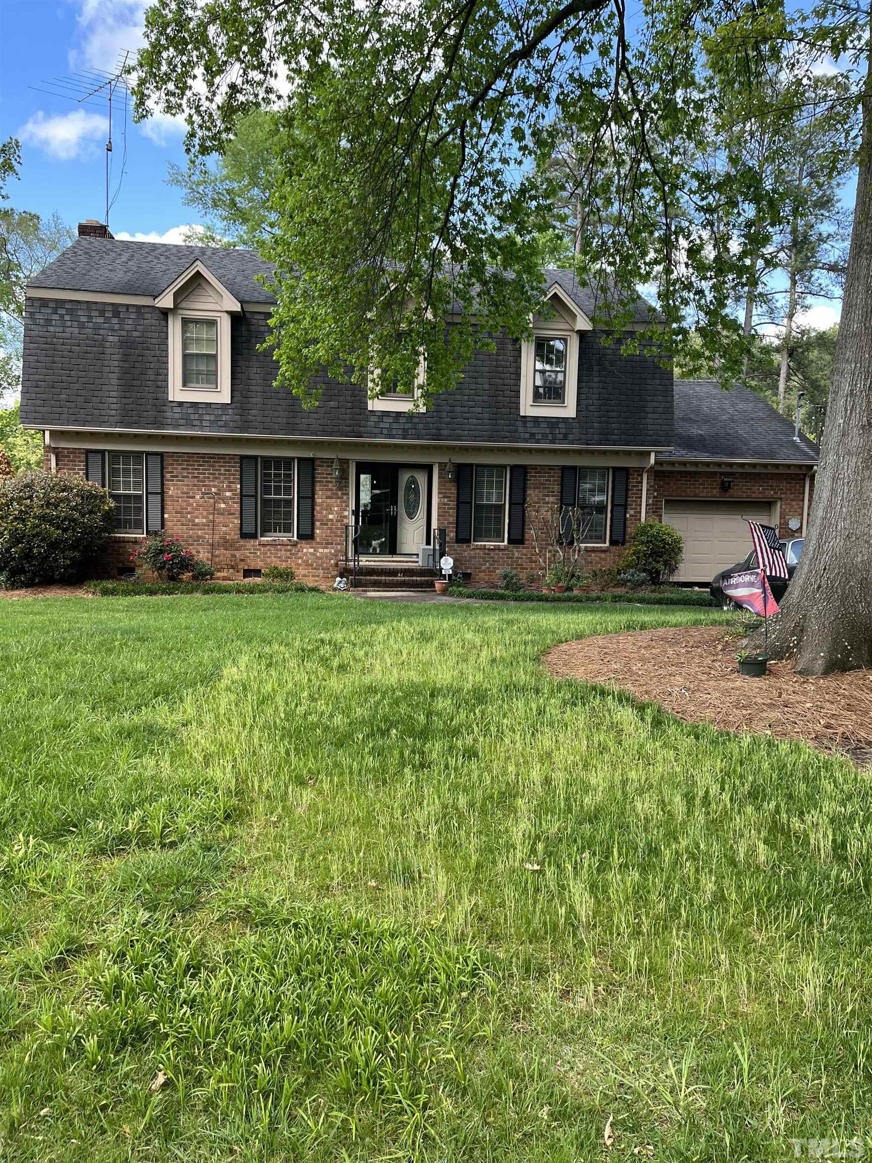 929 Deerfield Road Raleigh, NC 27609 - Photo 1 of 6 front view of a house with a garden