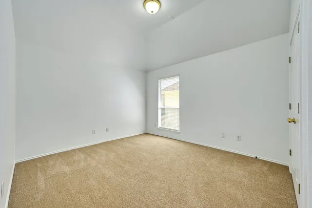 a view of a patio with couches chairs and wooden floor