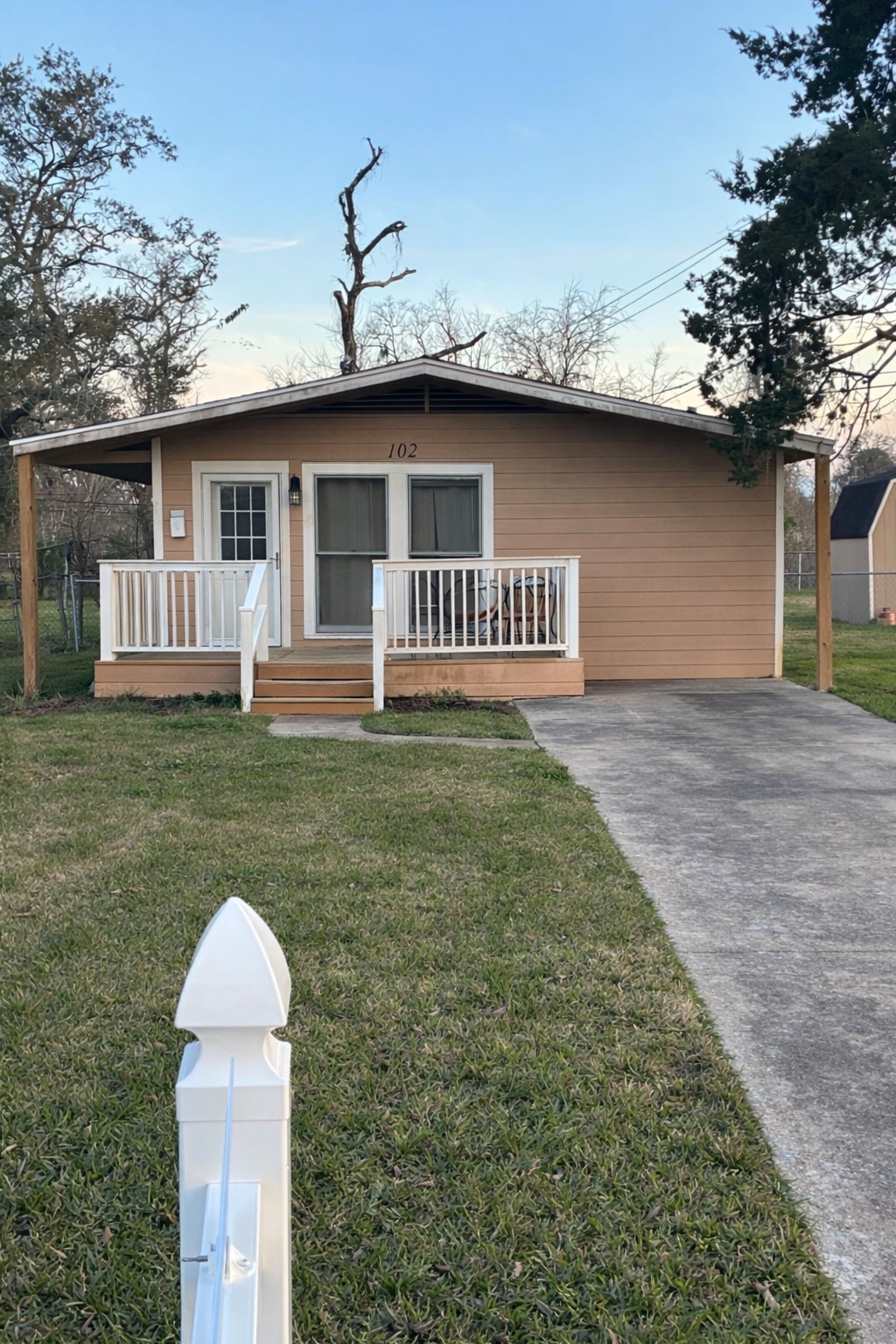 102 Magnolia Street Lake Jackson, TX 77566 - Photo 2 of 8 a backyard of a house with table and chairs