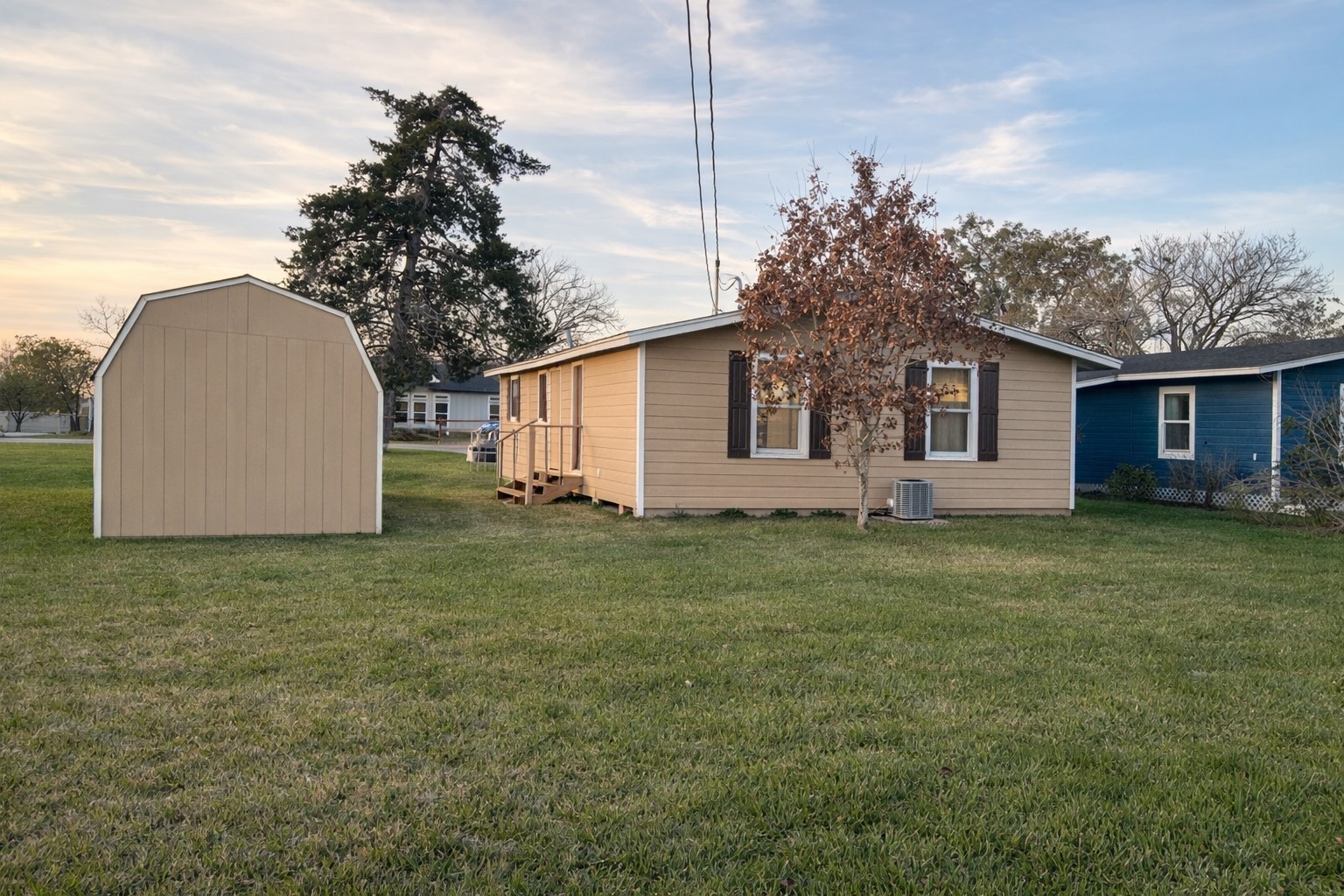 102 Magnolia Street Lake Jackson, TX 77566 - Photo 3 of 8 a view of a house with a backyard