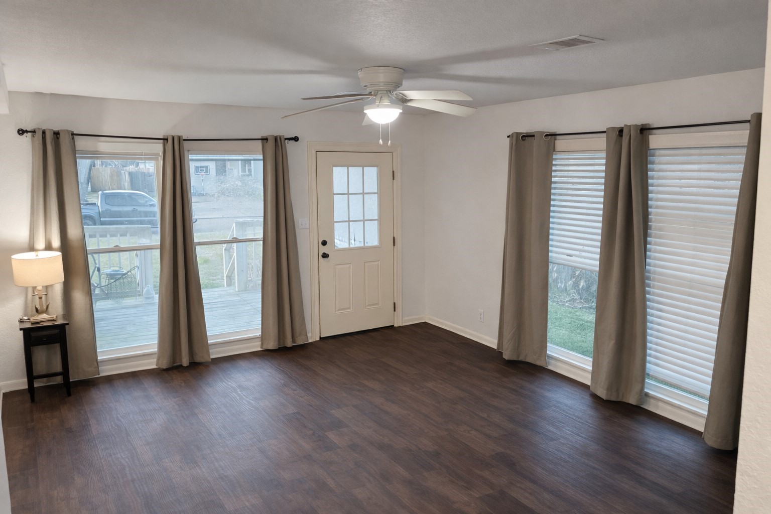 102 Magnolia Street Lake Jackson, TX 77566 - Photo 4 of 8 an empty room with wooden floor and windows