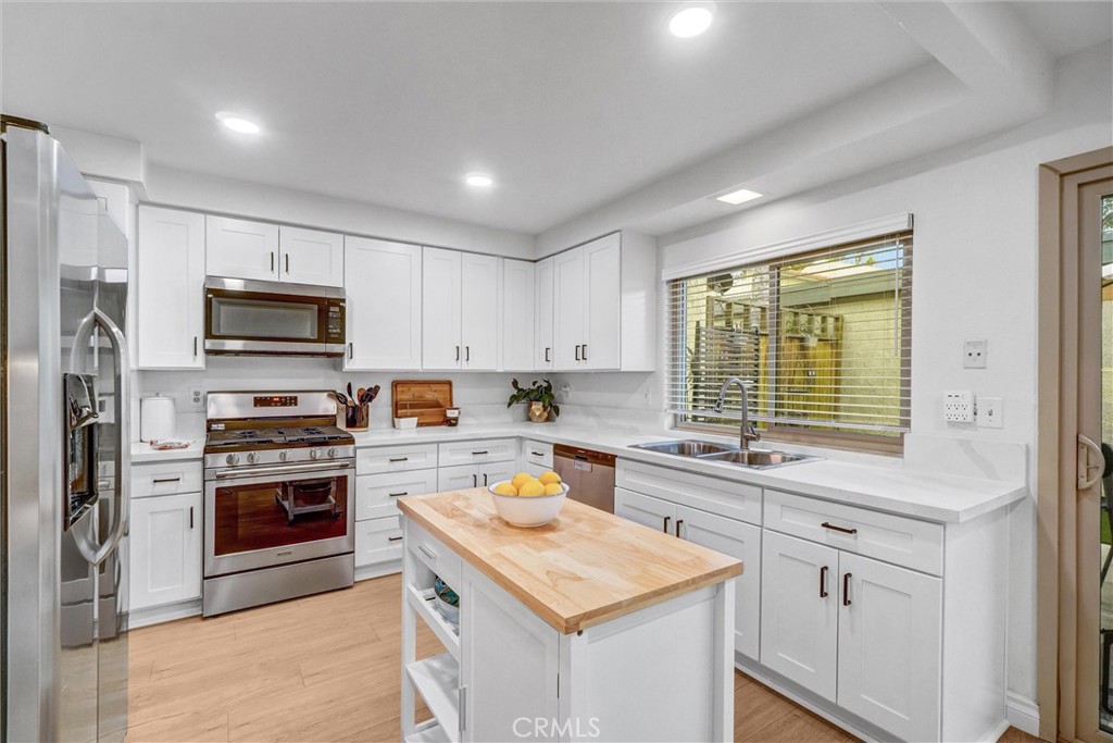 1514 Via Del Rio Corona, CA 92882 - Photo 11 of 41 a kitchen with a stove a sink and a microwave