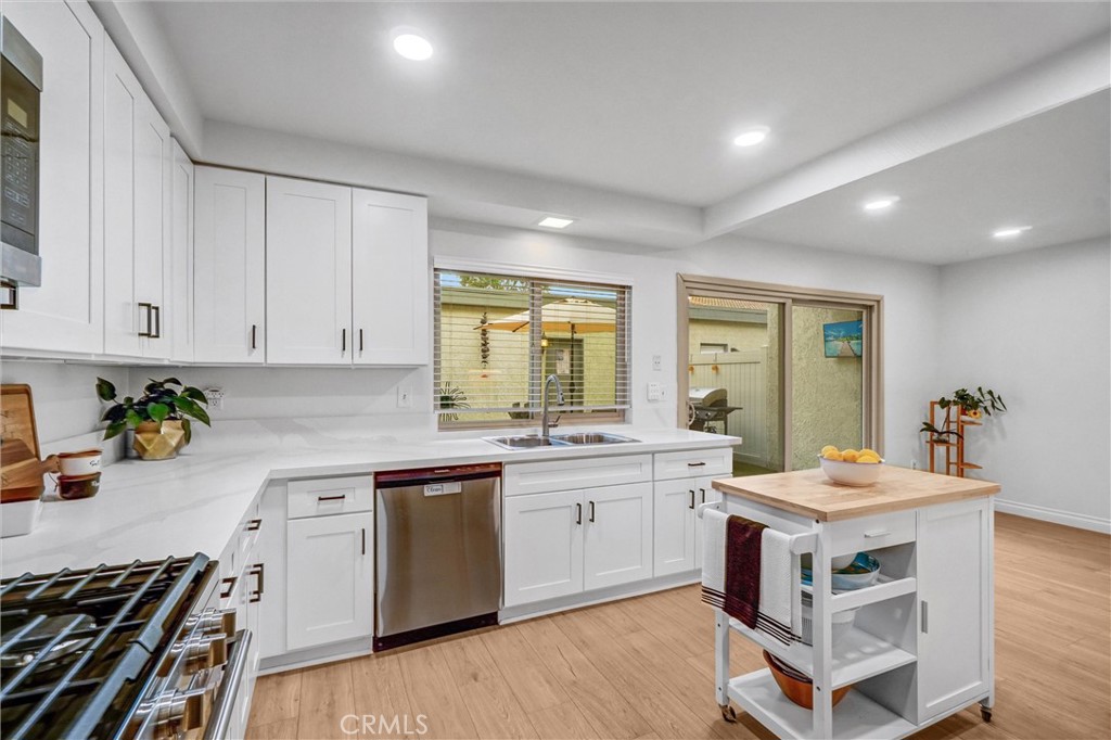 1514 Via Del Rio Corona, CA 92882 - Photo 13 of 41 a kitchen with a stove sink and cabinets