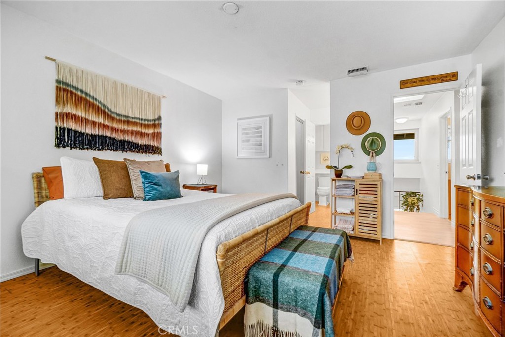 1514 Via Del Rio Corona, CA 92882 - Photo 18 of 41 a bedroom with a bed and wooden floor