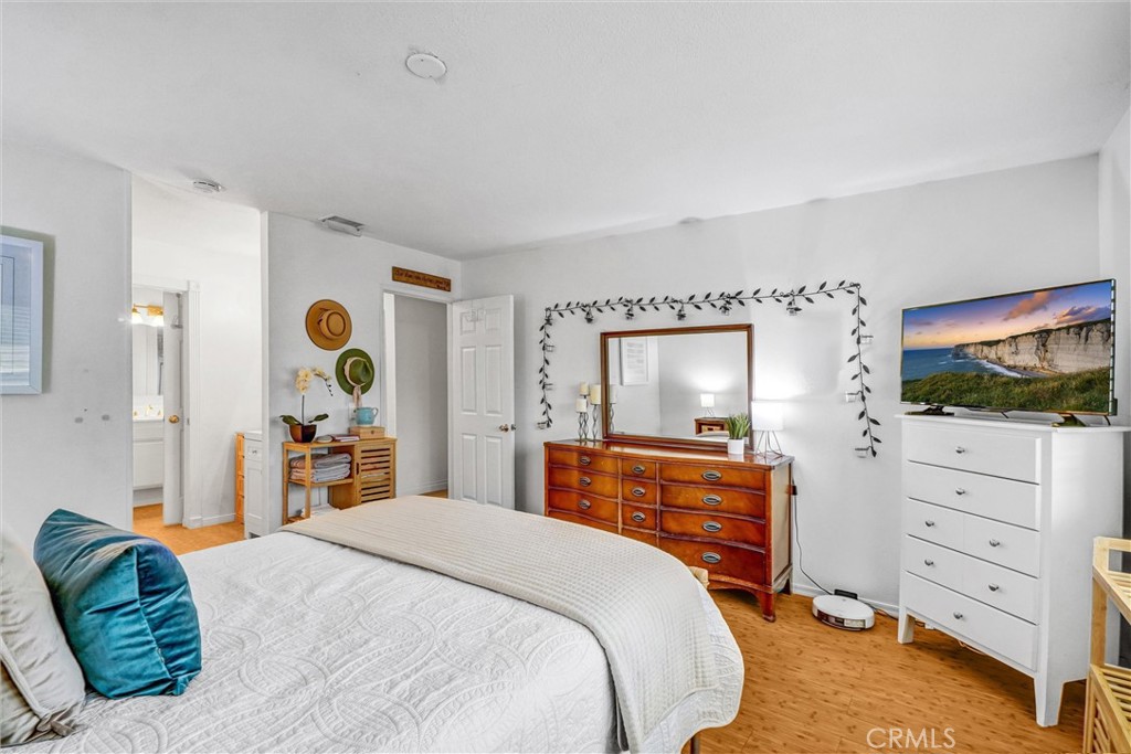 1514 Via Del Rio Corona, CA 92882 - Photo 19 of 41 a bedroom with a bed and a flat screen tv in it