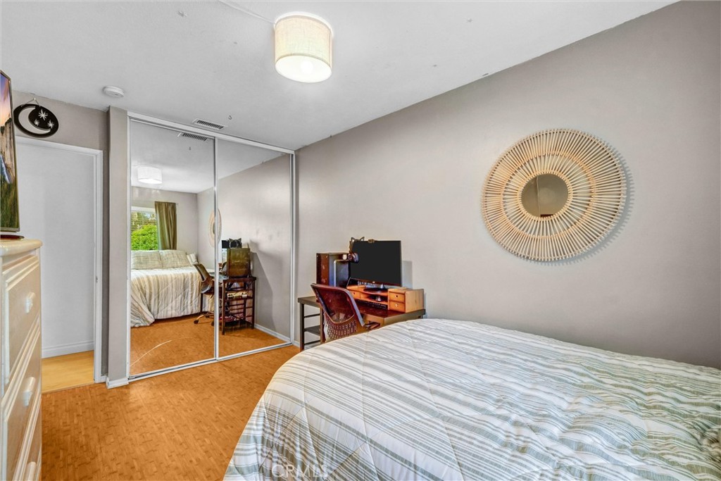 1514 Via Del Rio Corona, CA 92882 - Photo 22 of 41 a bedroom with a bed and a large mirror on the dresser