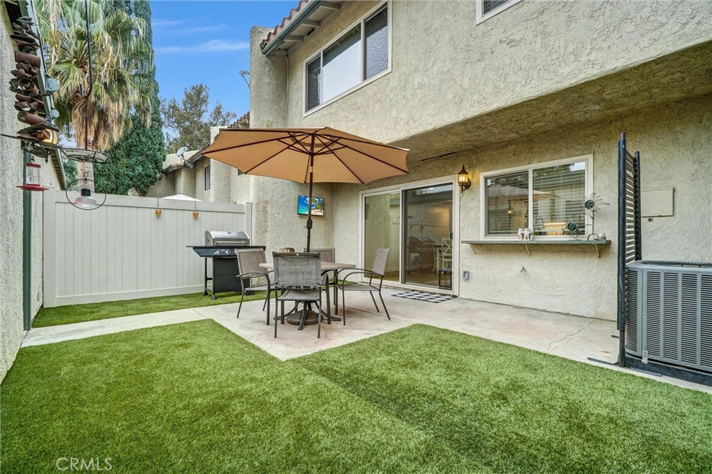 1514 Via Del Rio Corona, CA 92882 - Photo 27 of 41 a view of a patio with table and chairs under an umbrella