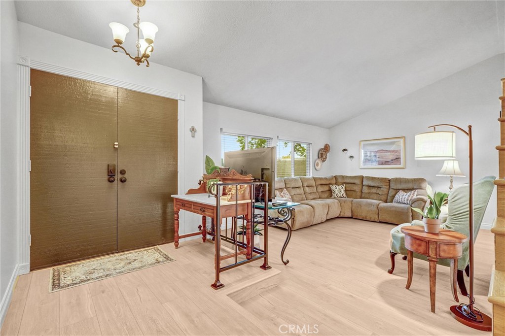 1514 Via Del Rio Corona, CA 92882 - Photo 4 of 41 a living room with furniture and a chandelier