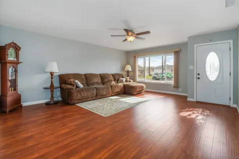 a living room with furniture and a large window