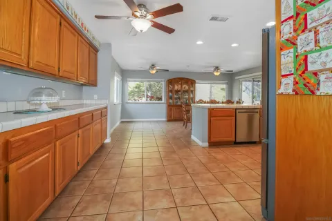 a kitchen with granite countertop cabinets and window