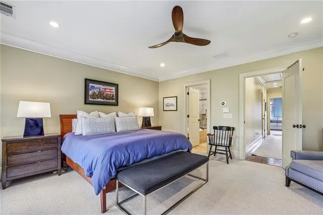 a bedroom with a bed and a lamp