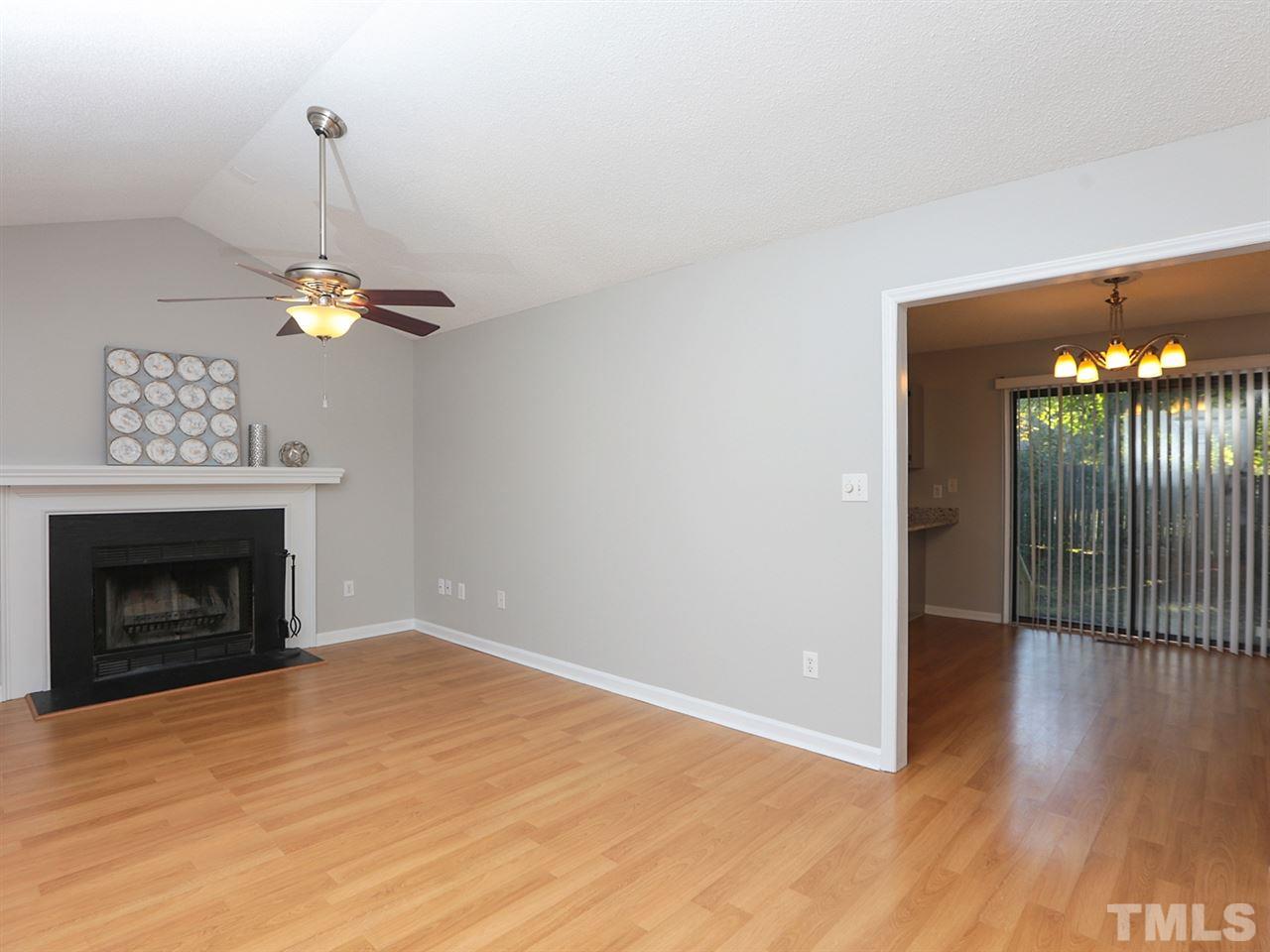 3537 East Jameson Road Raleigh, NC 27604 - Photo 7 of 17 a view of a room with furniture and a chandelier