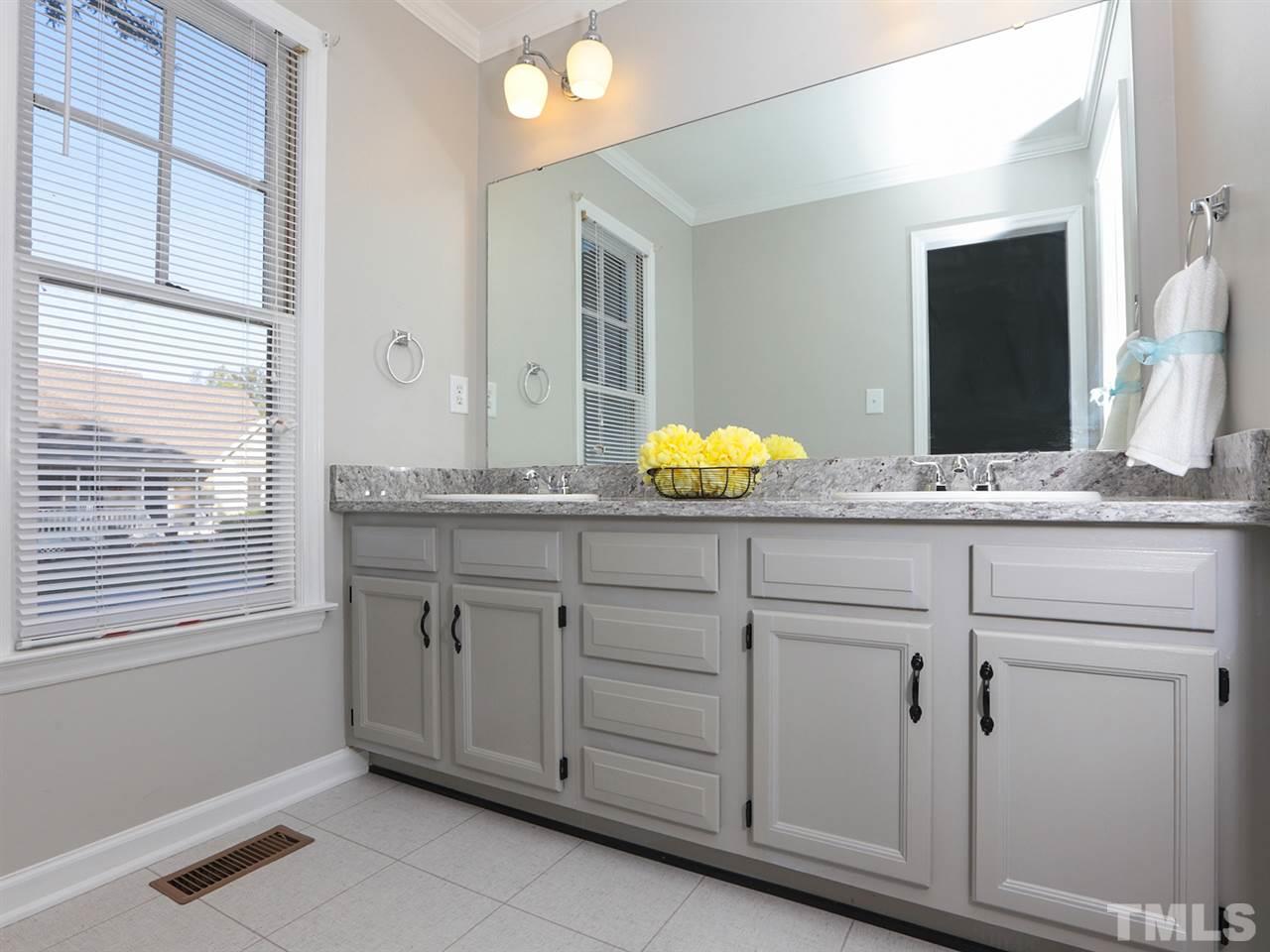 3537 East Jameson Road Raleigh, NC 27604 - Photo 10 of 17 a bathroom with a granite countertop sink and a mirror