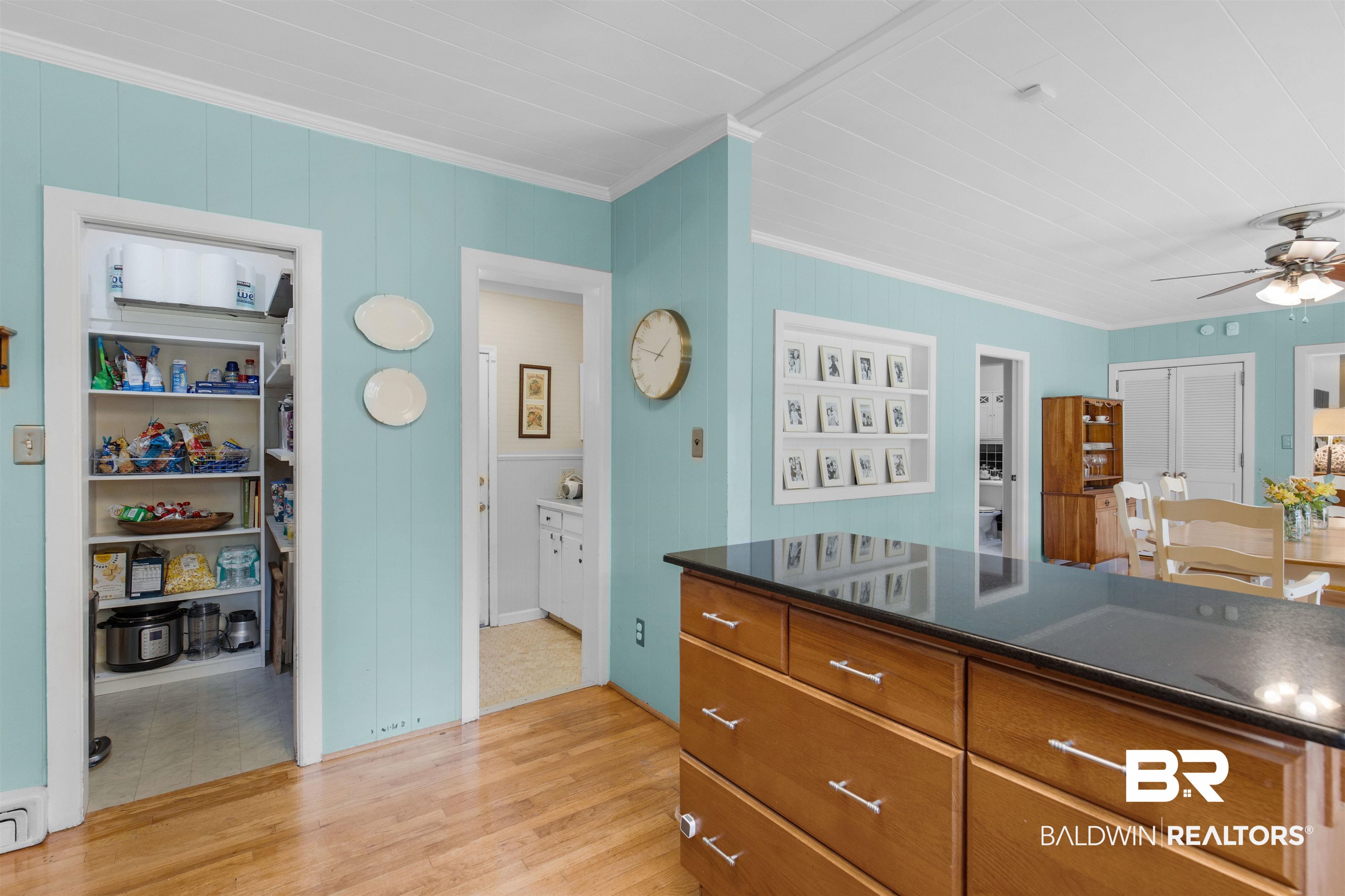 4306 Michael Boulevard Mobile, AL 36609 - Photo 7 of 35 Kitchen with crown molding, light hardwood / wood-style floors, ceiling fan, and a baseboard radiator